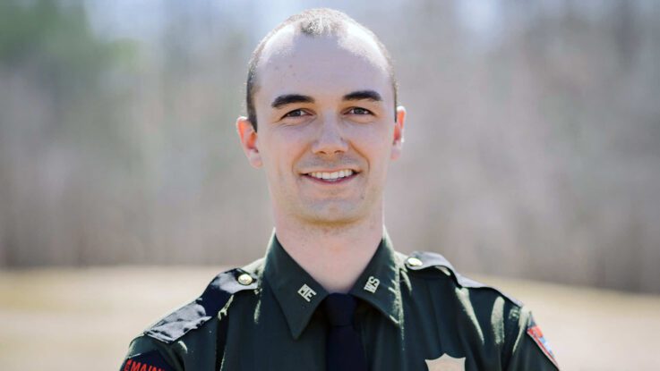 headshot of Kale O'Leary wearing a forest ranger uniform