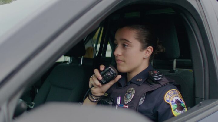 Officer Jess Combs speaks with dispatch over her cruiser's CB radio