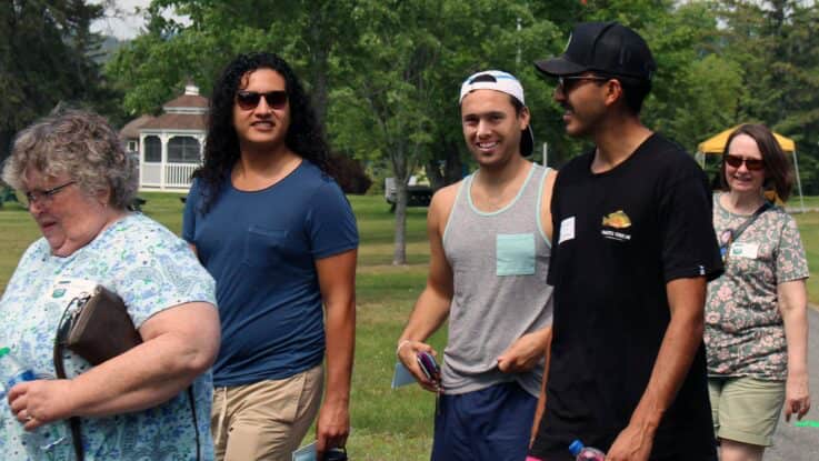 new students walking as a group along the quad during orientation