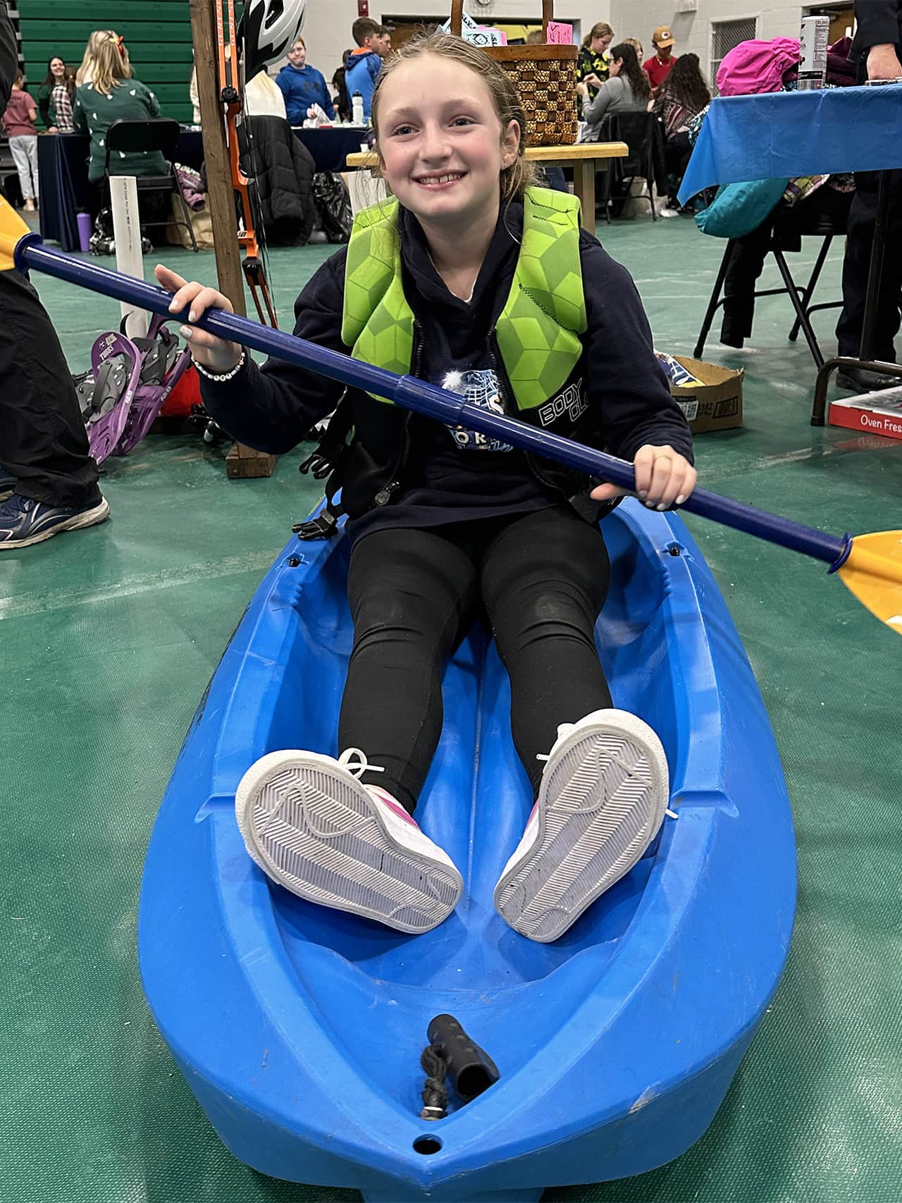 Elementary school student Charlotte Nadeau practices paddling a kayak