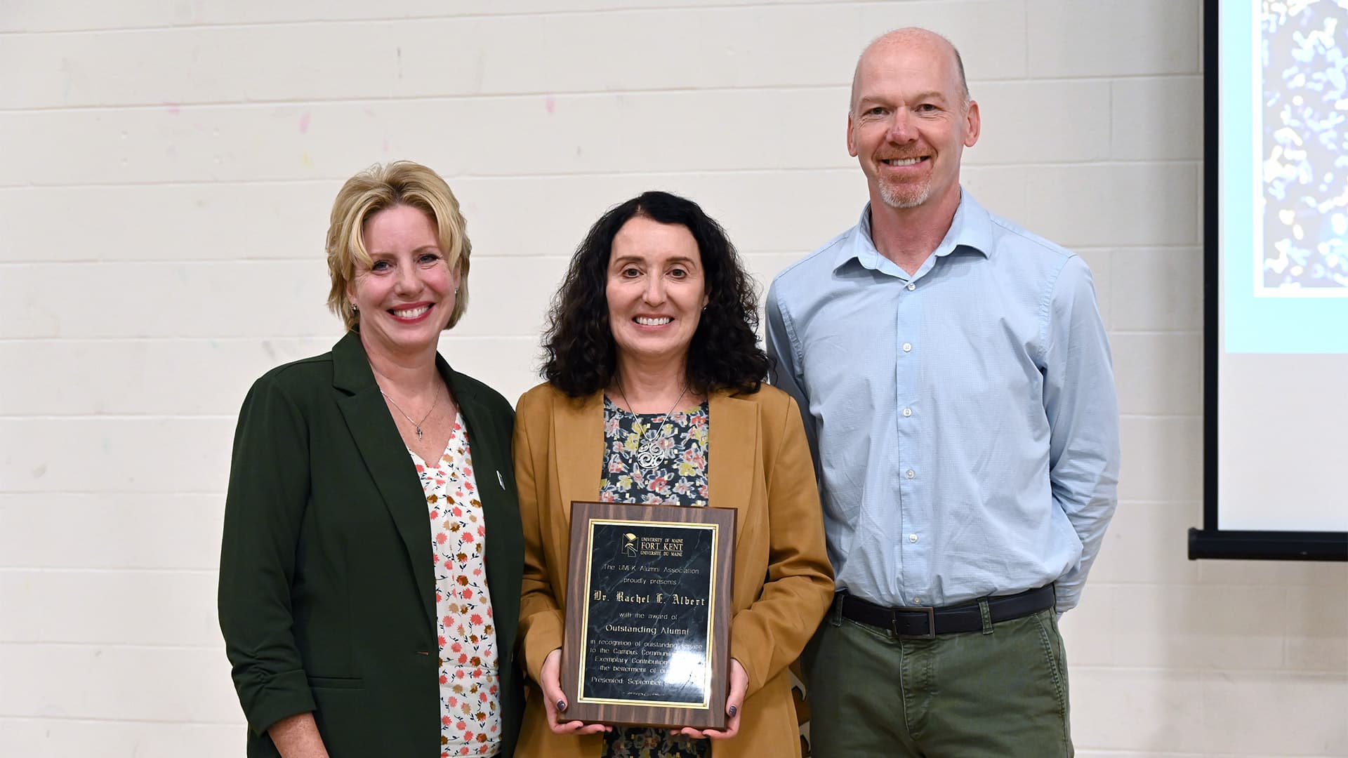 Photo of Dean of Nursing, Allied Health, and Behavioral Science Division Dr. Erin Soucy, UMFK class of 1995; 2023 Outstanding Alumna Rachel E. Albert; and UMFK Alumni President Don Chouinard, UMFK class of 1991